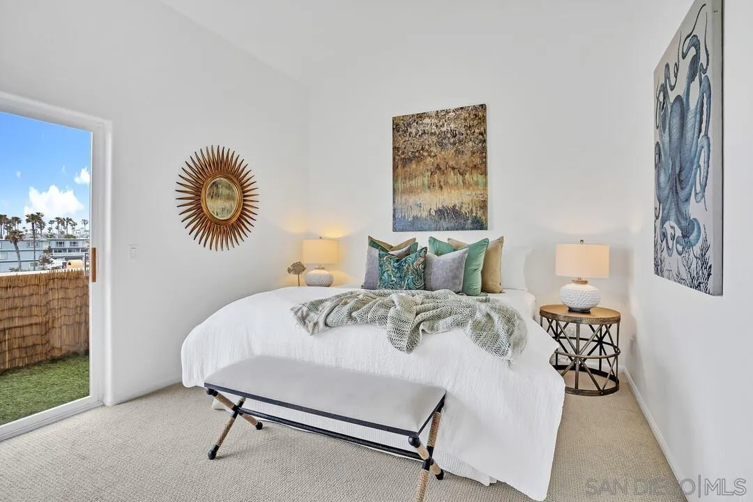 1206 Seacoast Drive, Unit C Imperial Beach, CA 91932 - Photo 13 of 32 a bedroom with a bed and a table in it