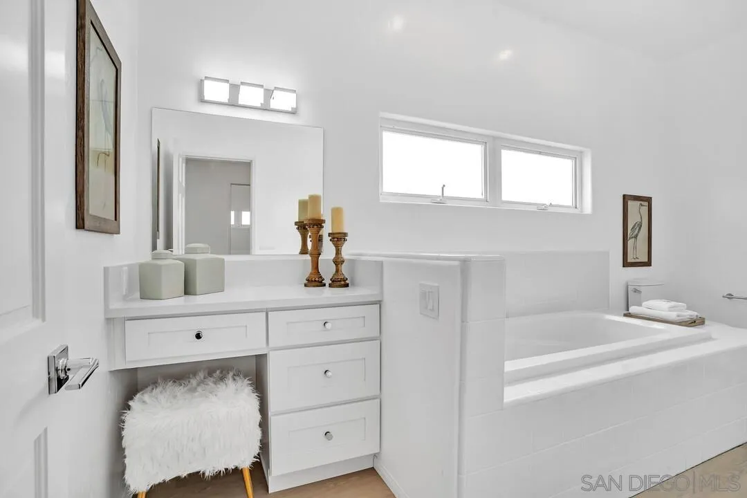 1206 Seacoast Drive, Unit C Imperial Beach, CA 91932 - Photo 18 of 32 a bathroom with a sink vanity and mirror