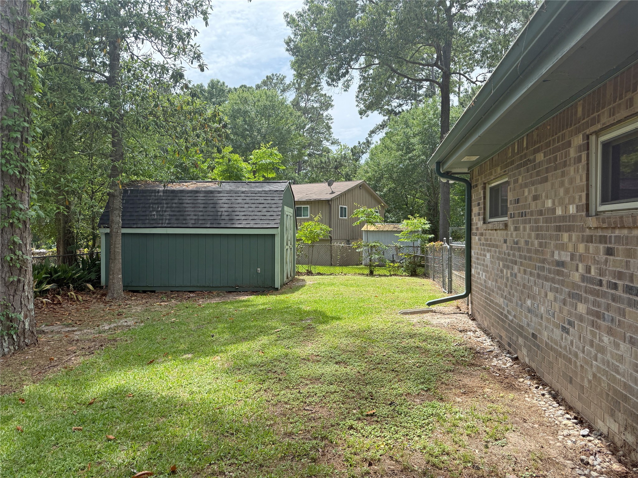 192 Sam Houston Loop Point Blank, TX 77364 - Photo 35 of 42 Left side of the house facing the back yard.