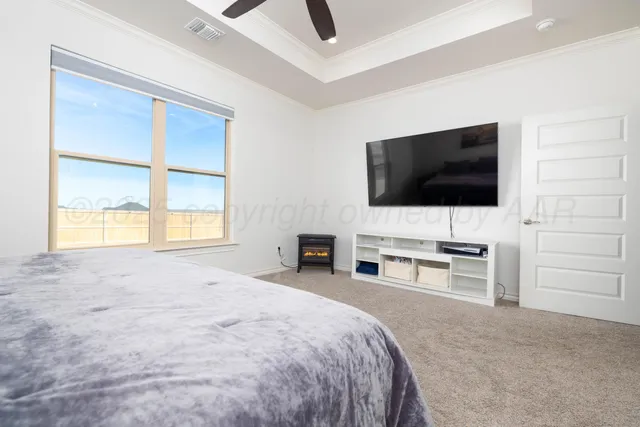 a spacious bathroom with a sink and a mirror