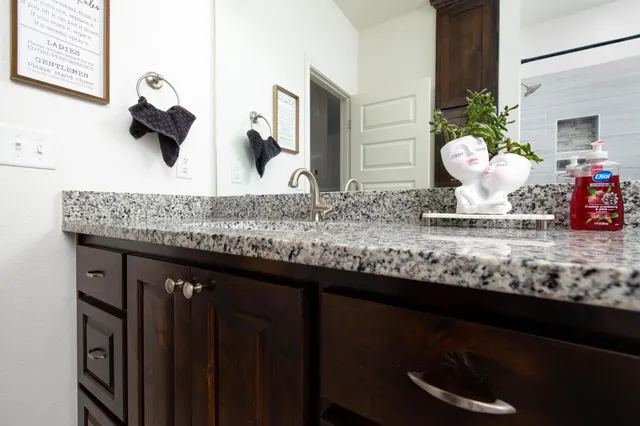 a bathroom with a bathtub and shower