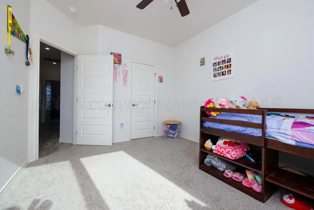 a bedroom with furniture and window