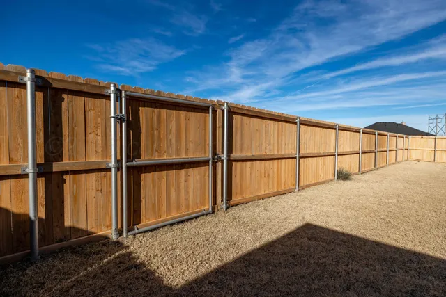 a view of house with yard