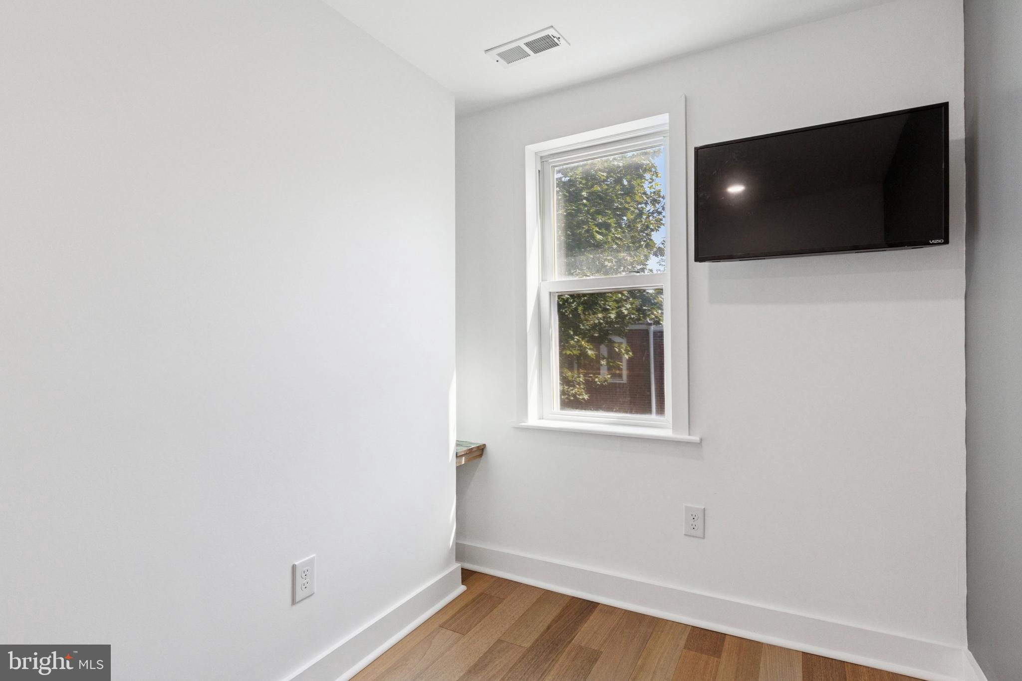 155 Sheldon Lane Ardmore, PA 19003 - Photo 14 of 17 a view of a livingroom with wooden floor and windows