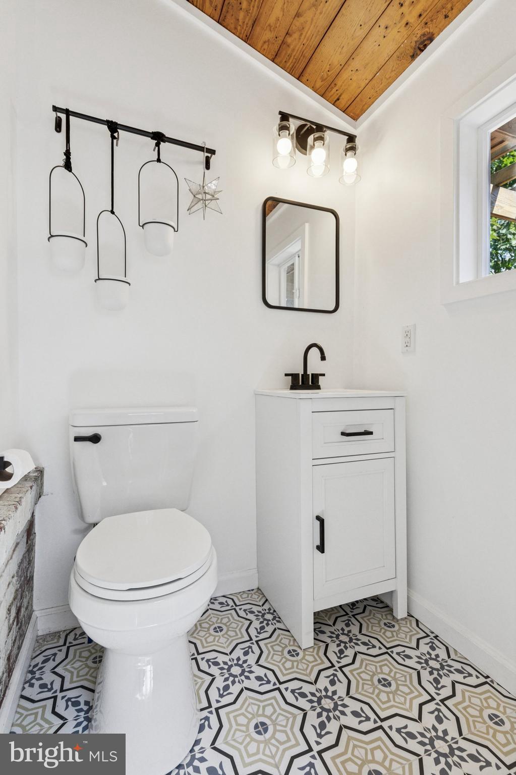 155 Sheldon Lane Ardmore, PA 19003 - Photo 9 of 17 a bathroom with a toilet a sink and mirror