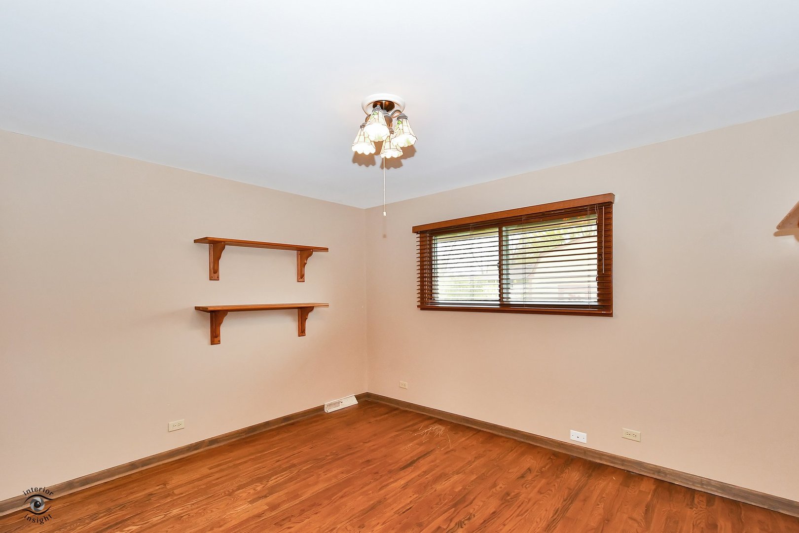 1712 Laurel Drive Mount Prospect, IL 60056 - Photo 16 of 26 a view of a room with wooden floor and window