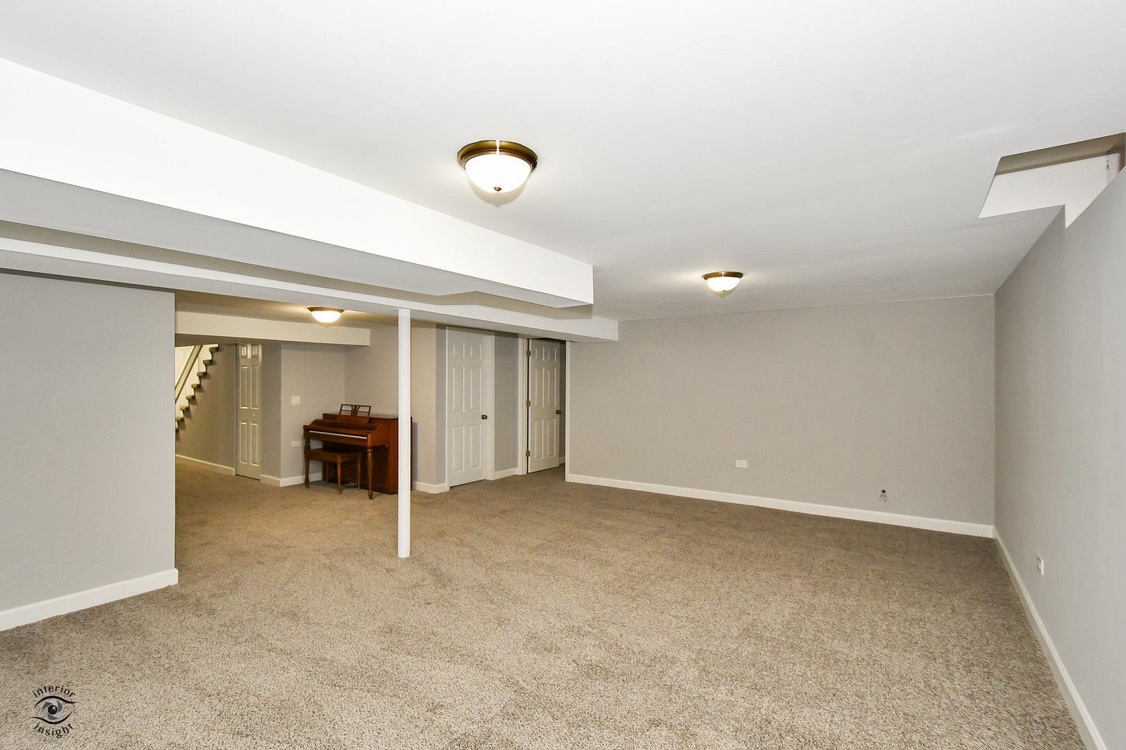 1712 Laurel Drive Mount Prospect, IL 60056 - Photo 19 of 26 an empty room with furniture and a ceiling fan