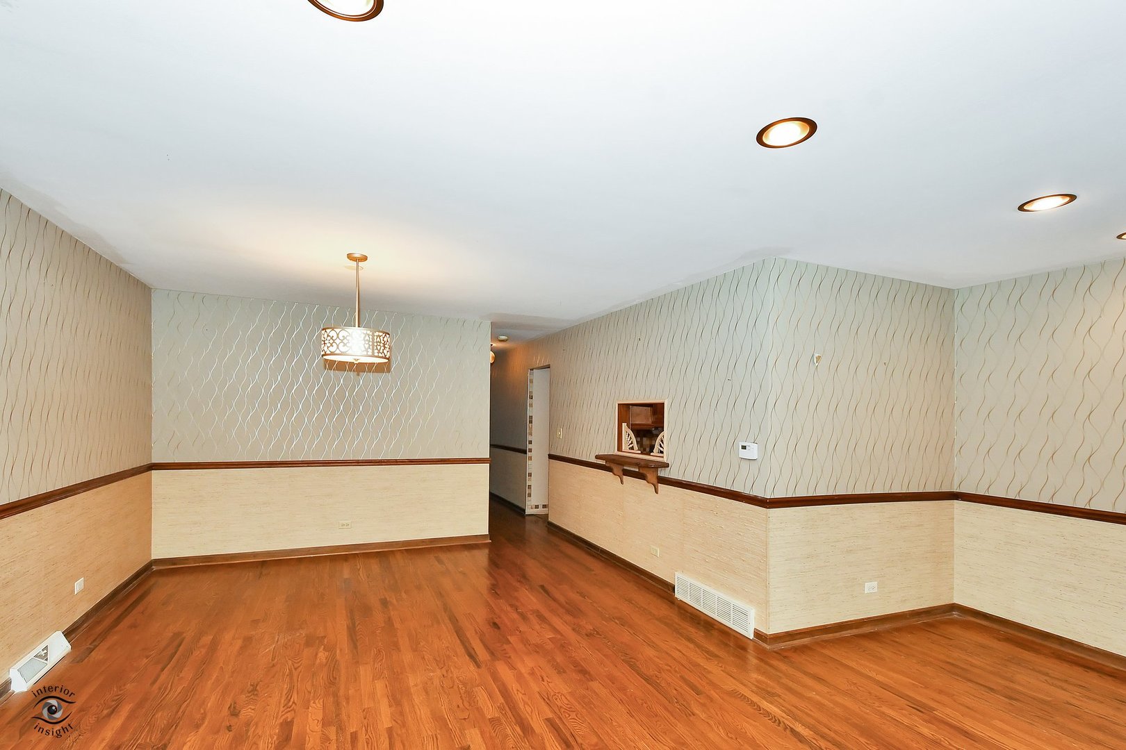 1712 Laurel Drive Mount Prospect, IL 60056 - Photo 5 of 26 a view of an empty room with wooden floor