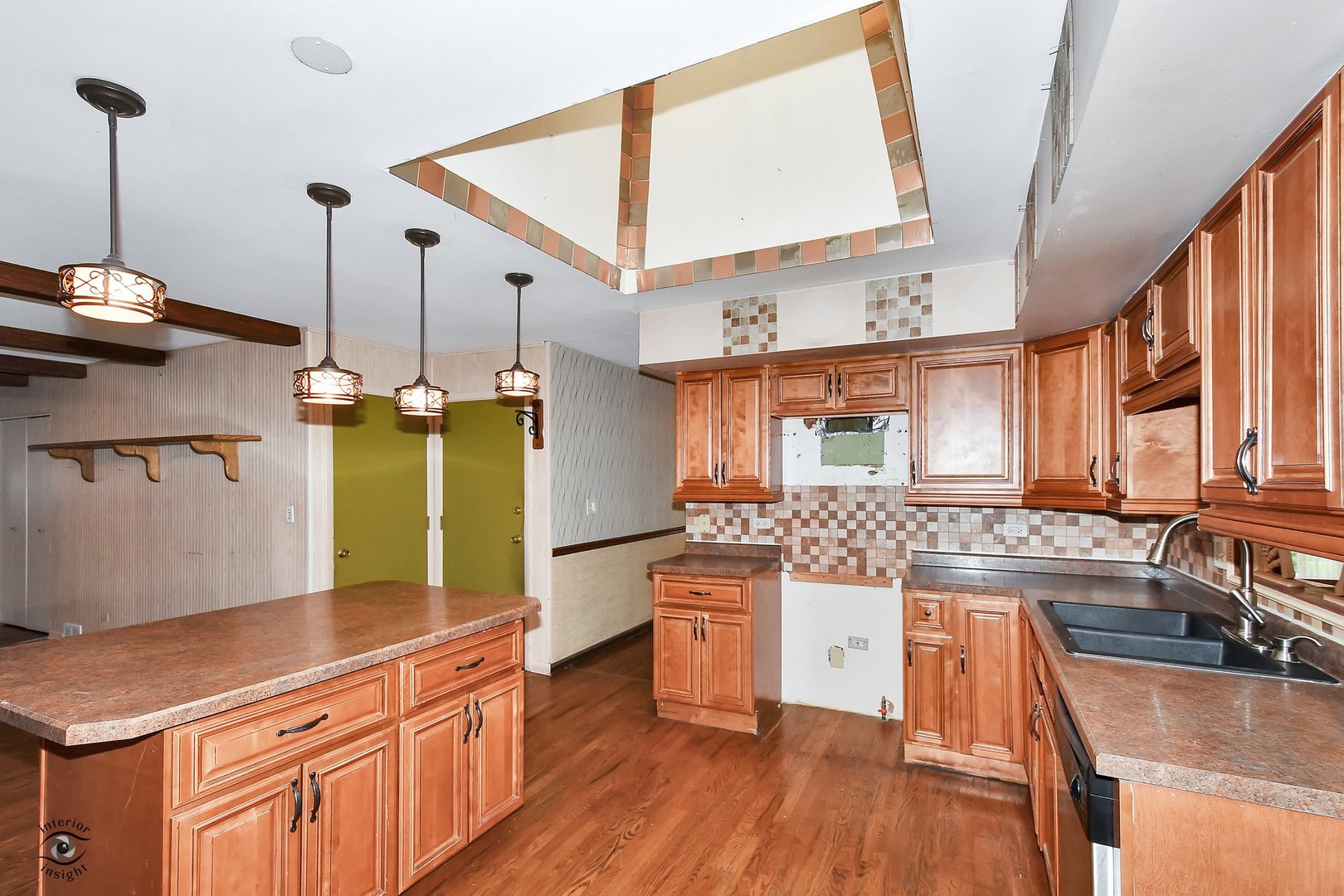 1712 Laurel Drive Mount Prospect, IL 60056 - Photo 7 of 26 a kitchen with stainless steel appliances granite countertop a sink a stove and a wooden floors