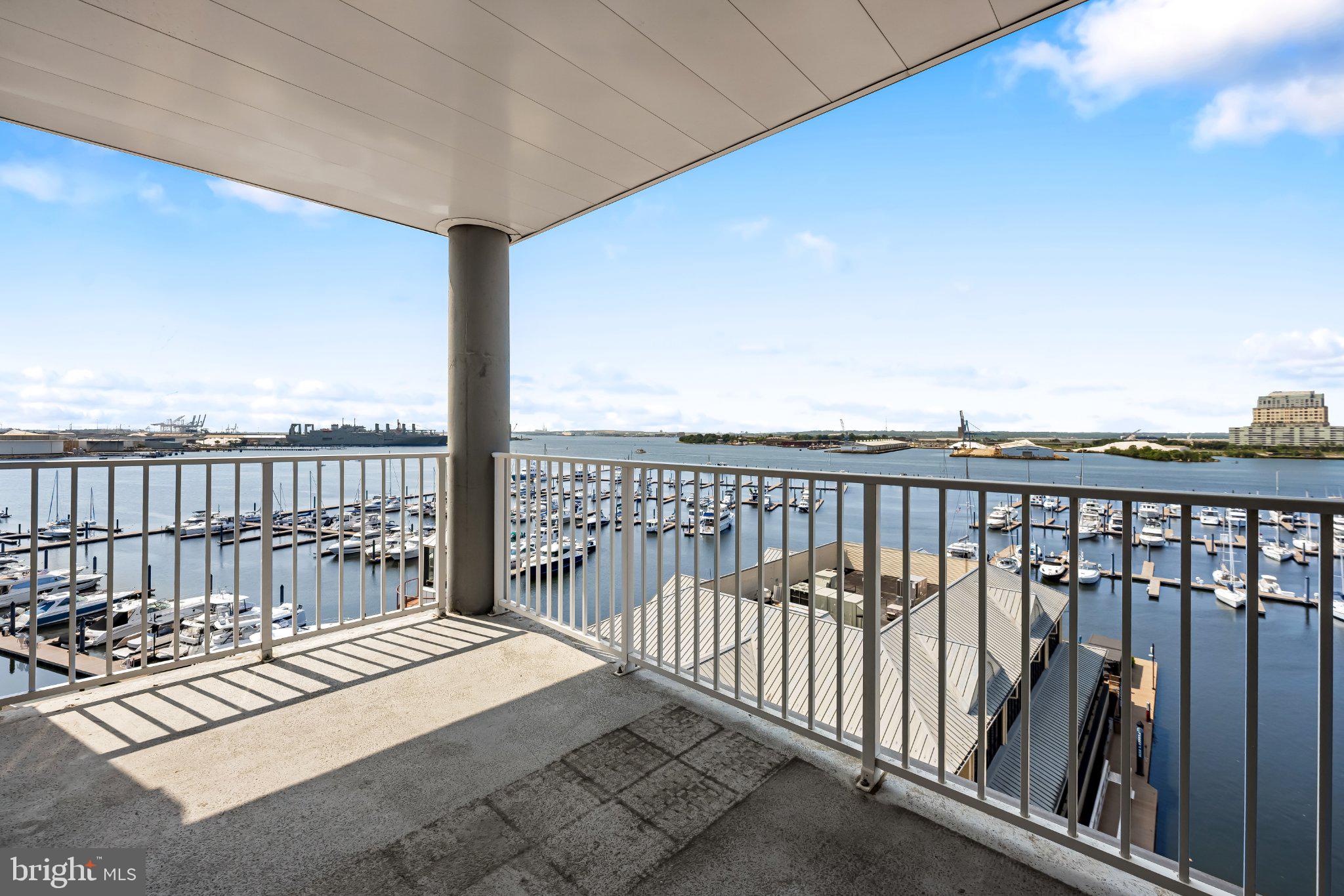 2702 Lighthouse Point East, Unit 738 Baltimore, MD 21224 - Photo 16 of 33 Scenic waterfront balcony view.