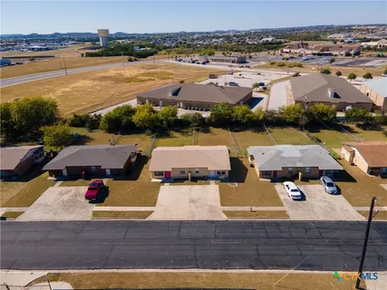 an aerial view of a house with lake view