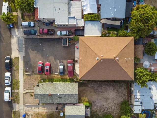 an aerial view of a house with a yard and a fountain