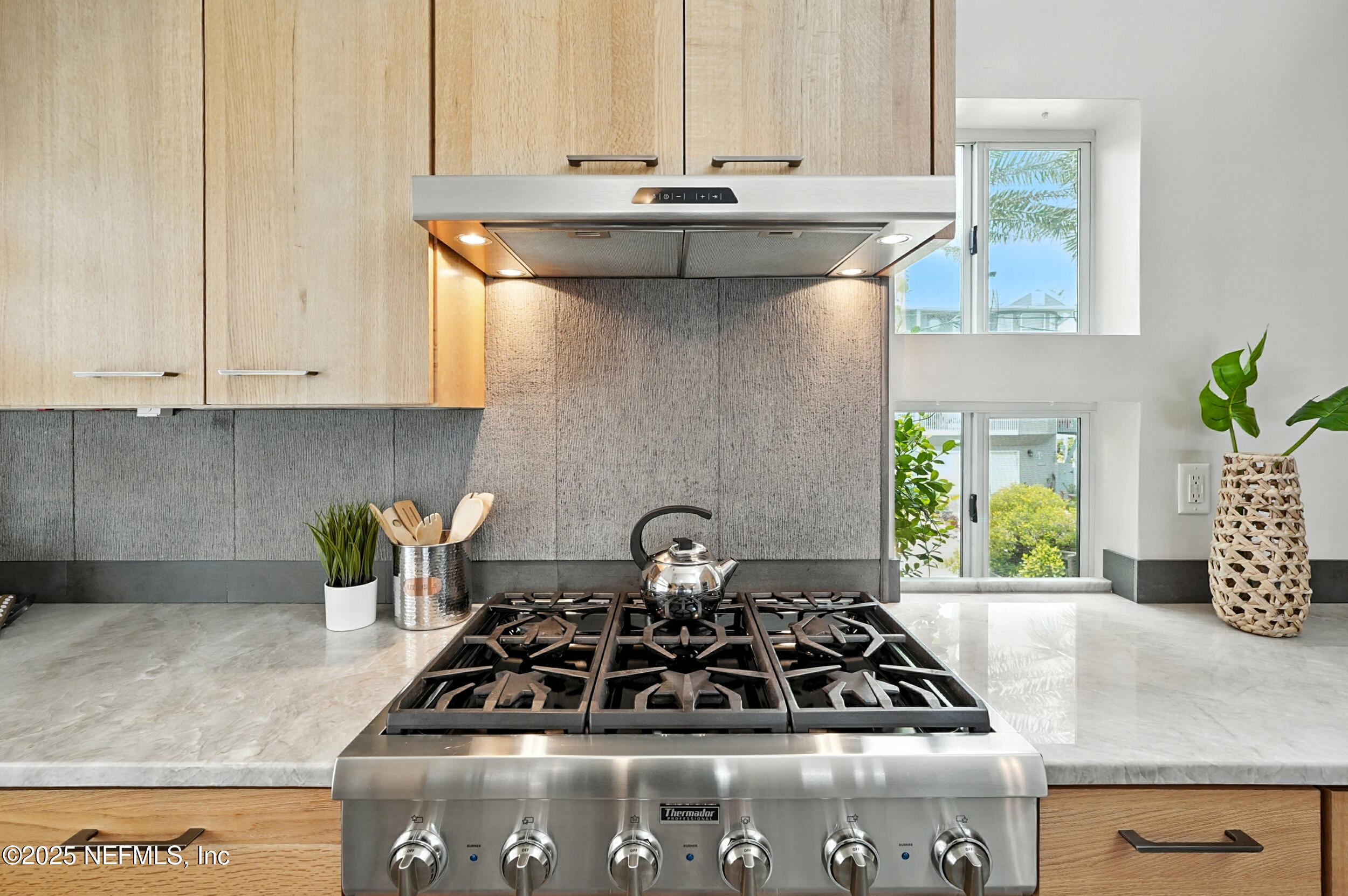 1789 Beach Avenue Atlantic Beach, FL 32233 - Photo 11 of 55 a kitchen with a stove and a white cabinets