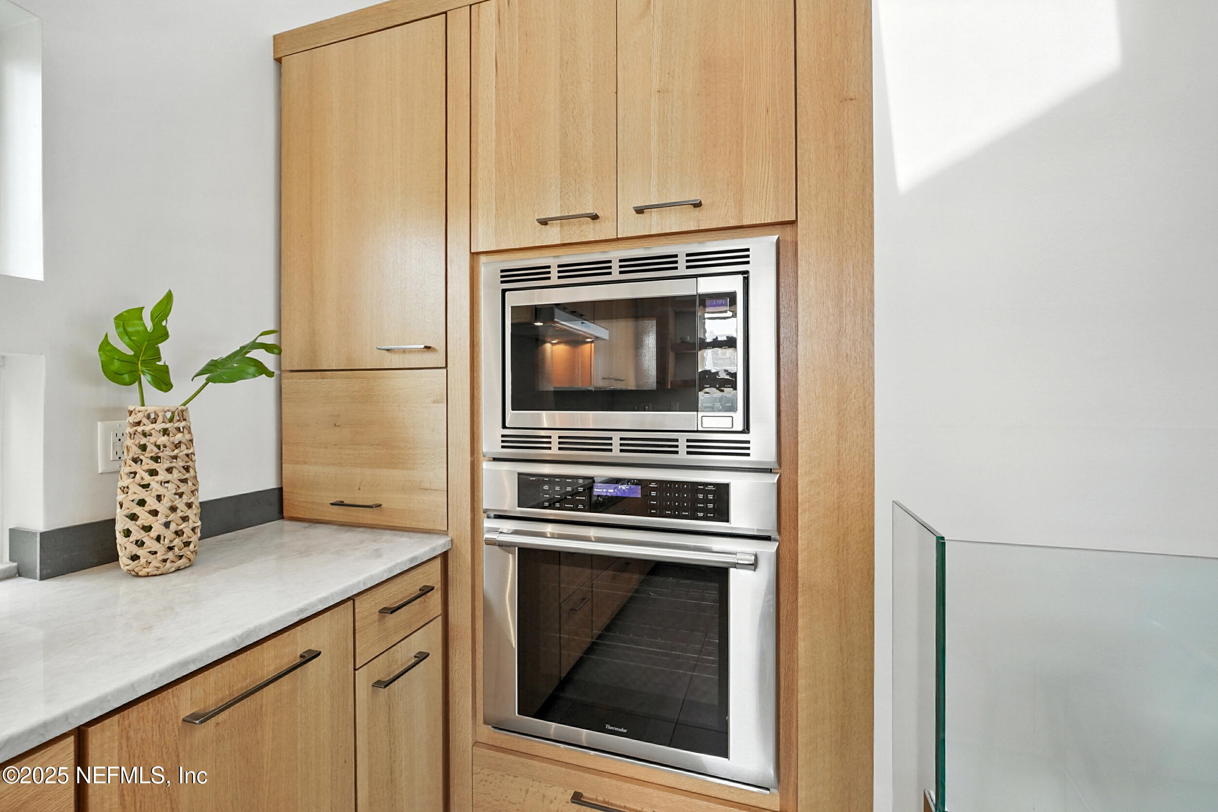 1789 Beach Avenue Atlantic Beach, FL 32233 - Photo 12 of 55 a kitchen with granite countertop a stove sink and cabinets