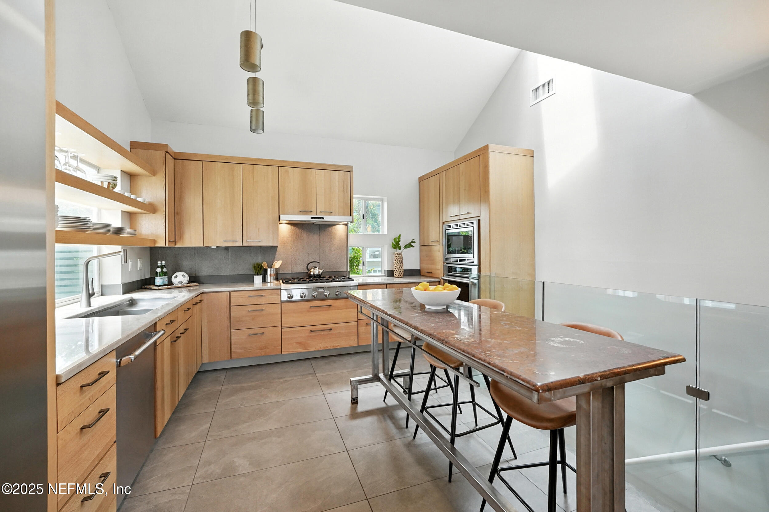 1789 Beach Avenue Atlantic Beach, FL 32233 - Photo 13 of 55 a kitchen with a sink a counter top space and stainless steel appliances