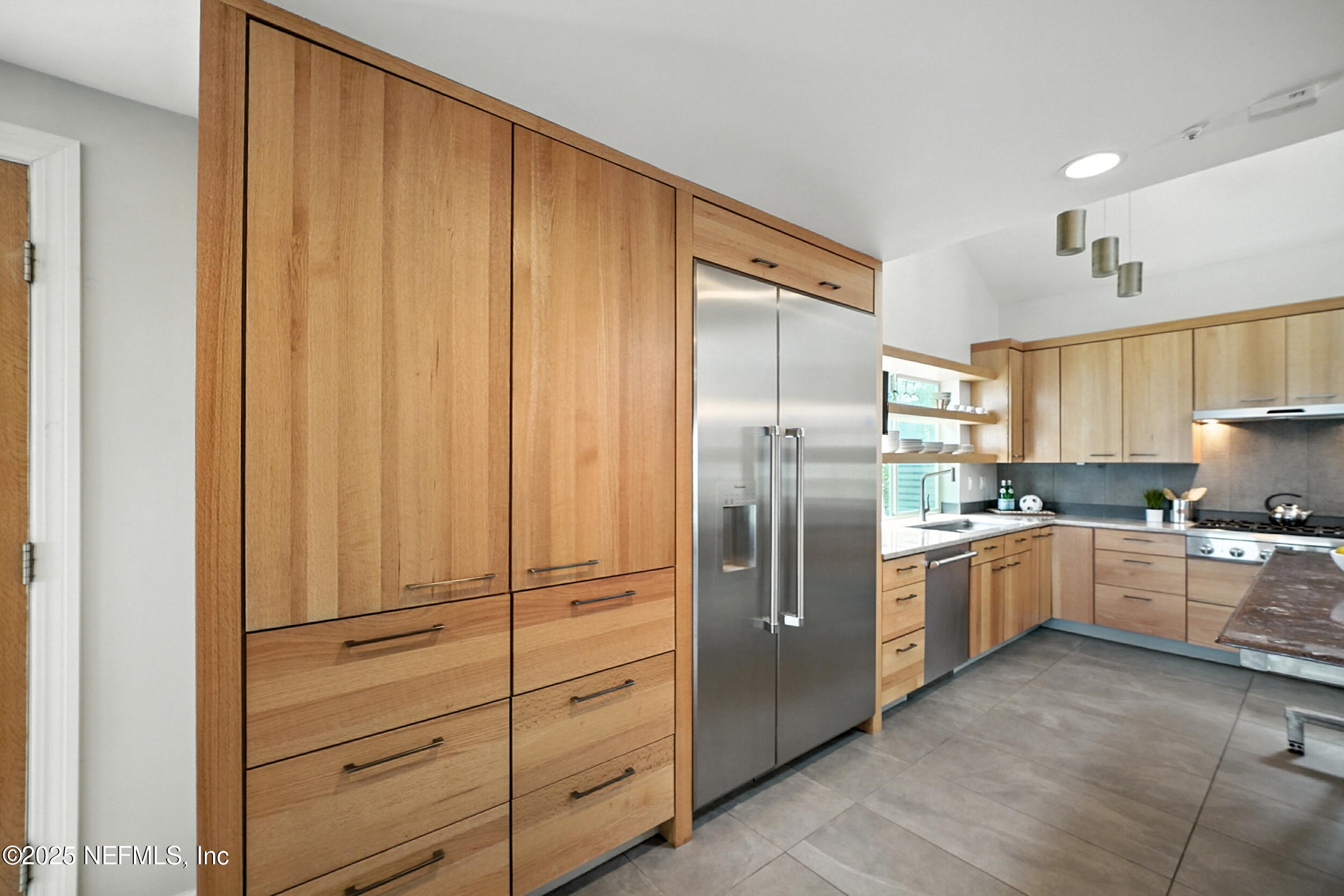 1789 Beach Avenue Atlantic Beach, FL 32233 - Photo 15 of 55 a kitchen with stainless steel appliances granite countertop a refrigerator and cabinets