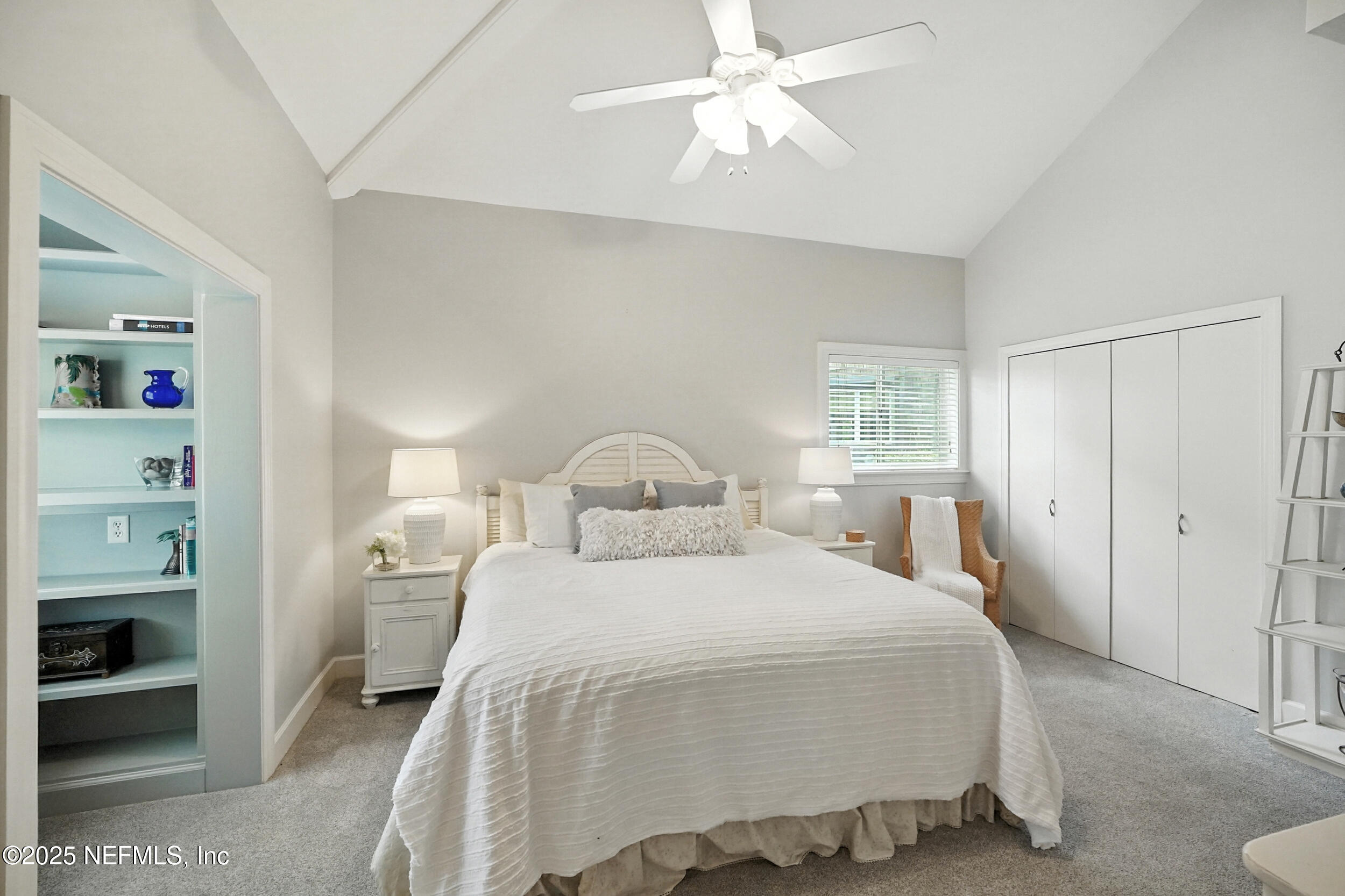 1789 Beach Avenue Atlantic Beach, FL 32233 - Photo 16 of 55 a bedroom with a bed and a chandelier