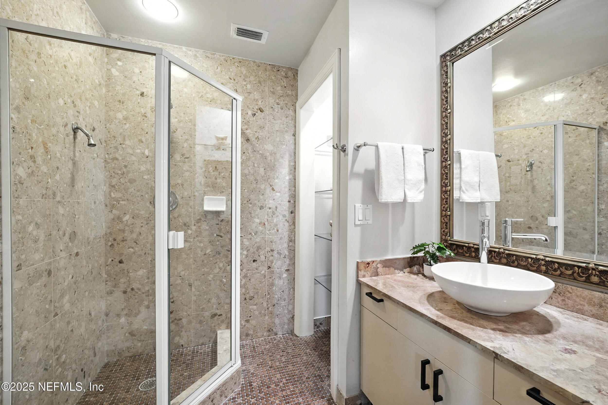 1789 Beach Avenue Atlantic Beach, FL 32233 - Photo 19 of 55 a bathroom with a granite countertop sink and a mirror