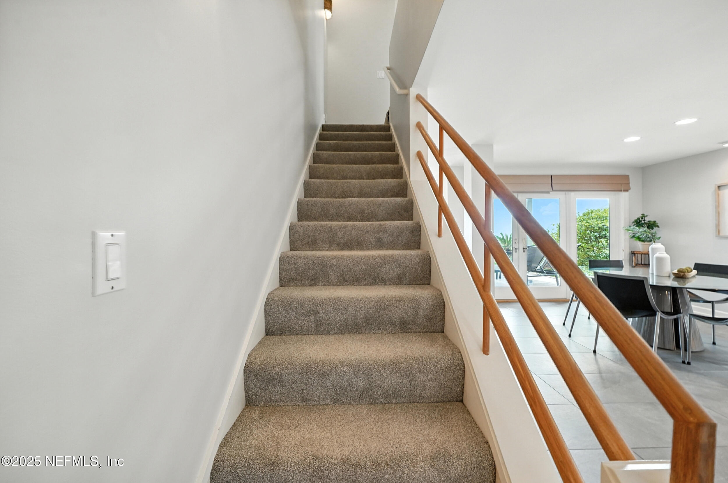 1789 Beach Avenue Atlantic Beach, FL 32233 - Photo 20 of 55 a view of staircase with wooden floor and white walls
