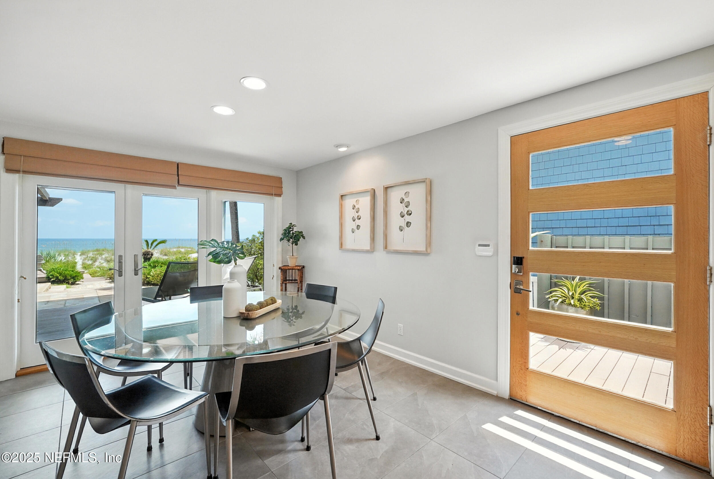 1789 Beach Avenue Atlantic Beach, FL 32233 - Photo 2 of 55 a dining room with furniture wooden floor and a potted plant