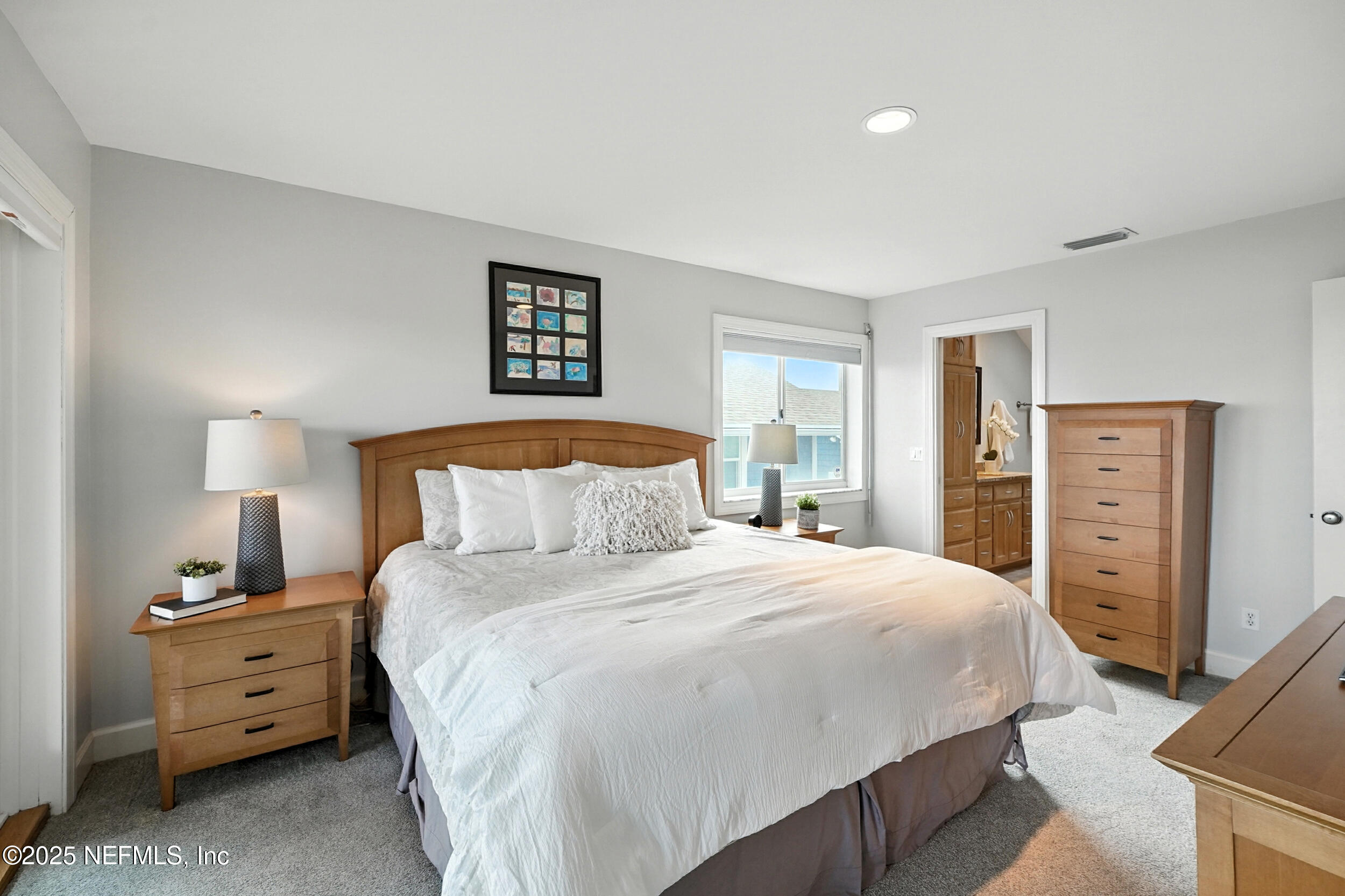 1789 Beach Avenue Atlantic Beach, FL 32233 - Photo 23 of 55 a bedroom with a bed and a closet