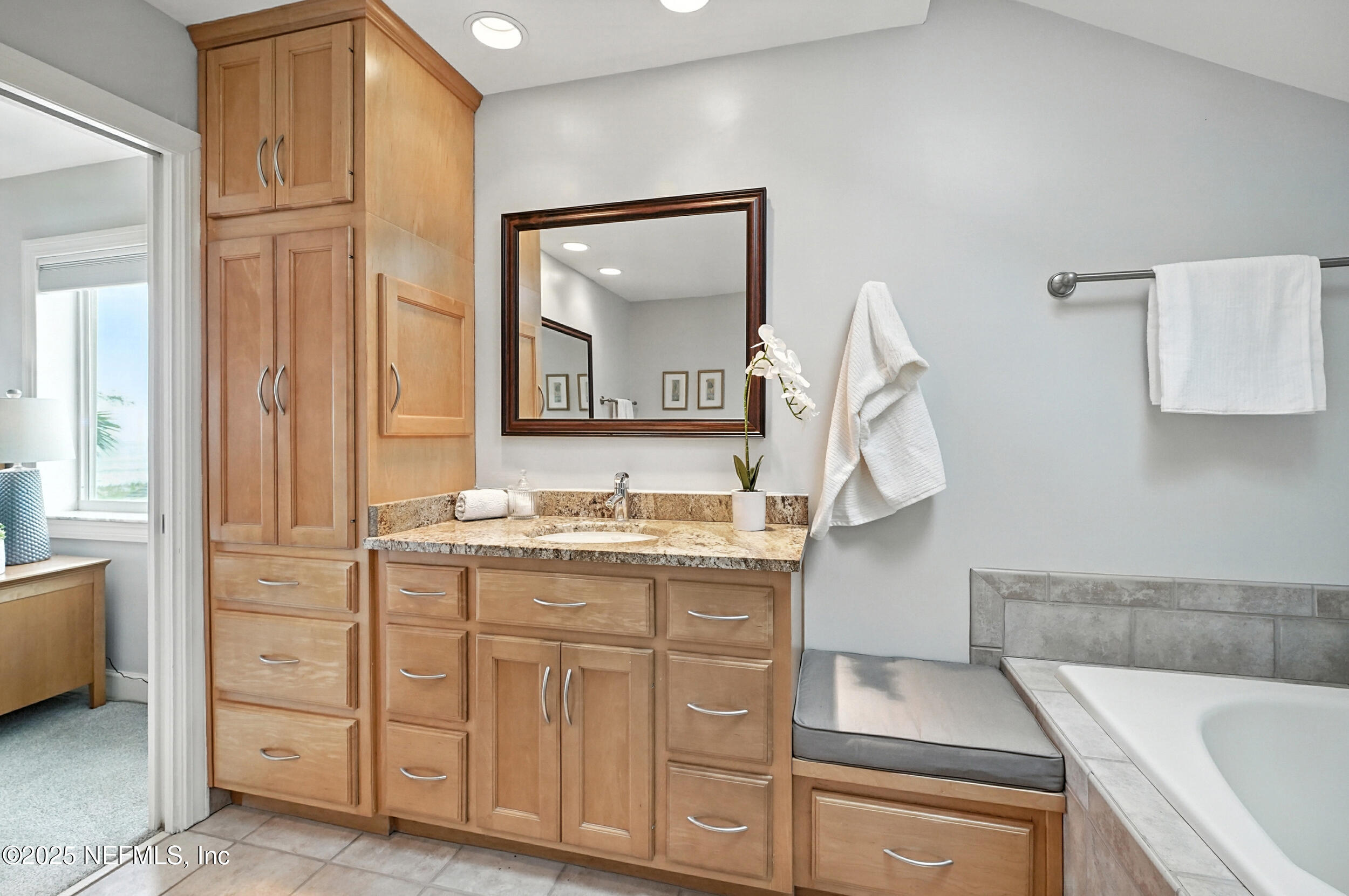 1789 Beach Avenue Atlantic Beach, FL 32233 - Photo 24 of 55 a bathroom with a sink and a mirror