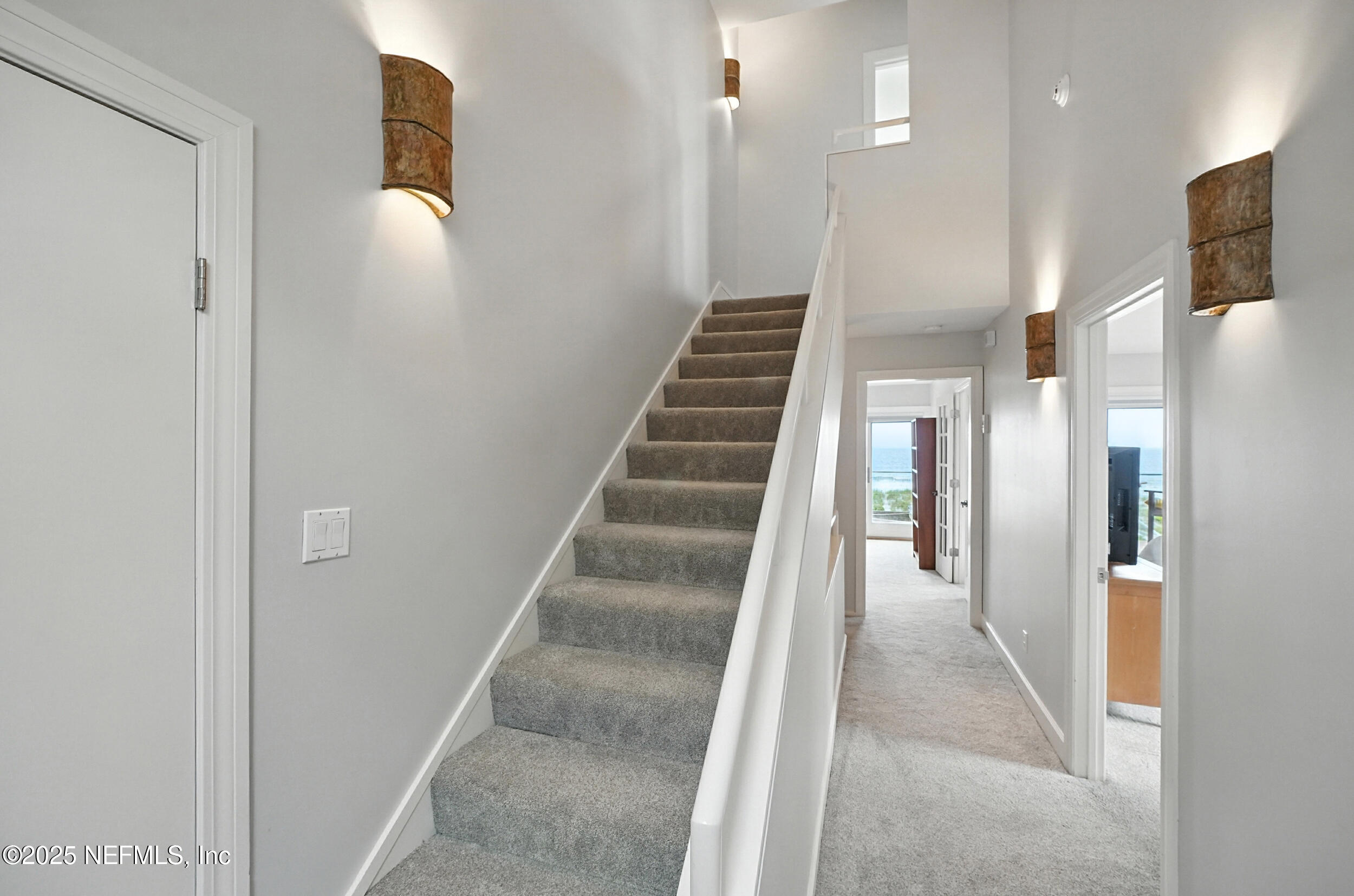 1789 Beach Avenue Atlantic Beach, FL 32233 - Photo 31 of 55 a view of a hallway with staircase and a glass door