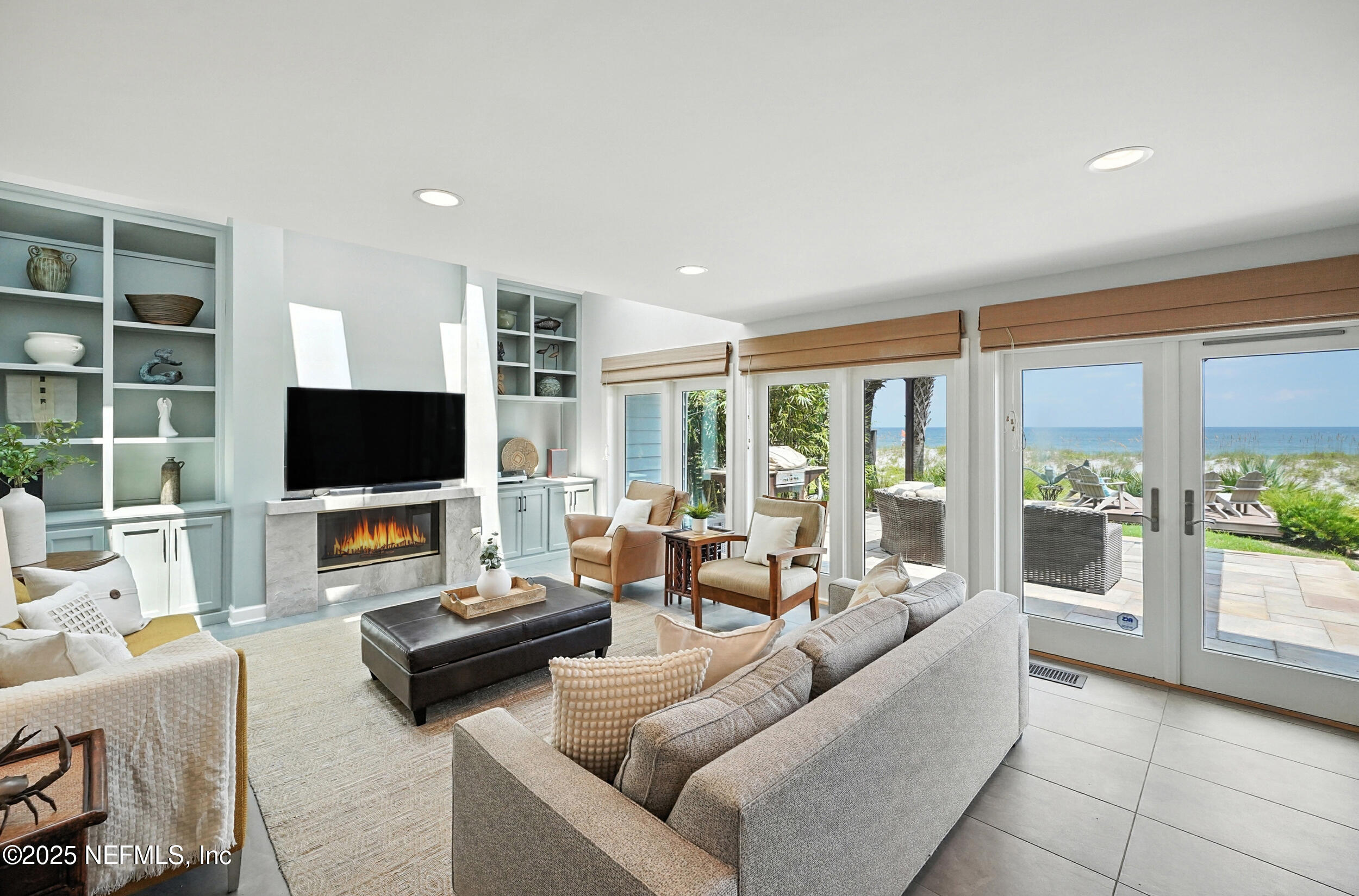 1789 Beach Avenue Atlantic Beach, FL 32233 - Photo 6 of 55 a living room with furniture a flat screen tv and a large window