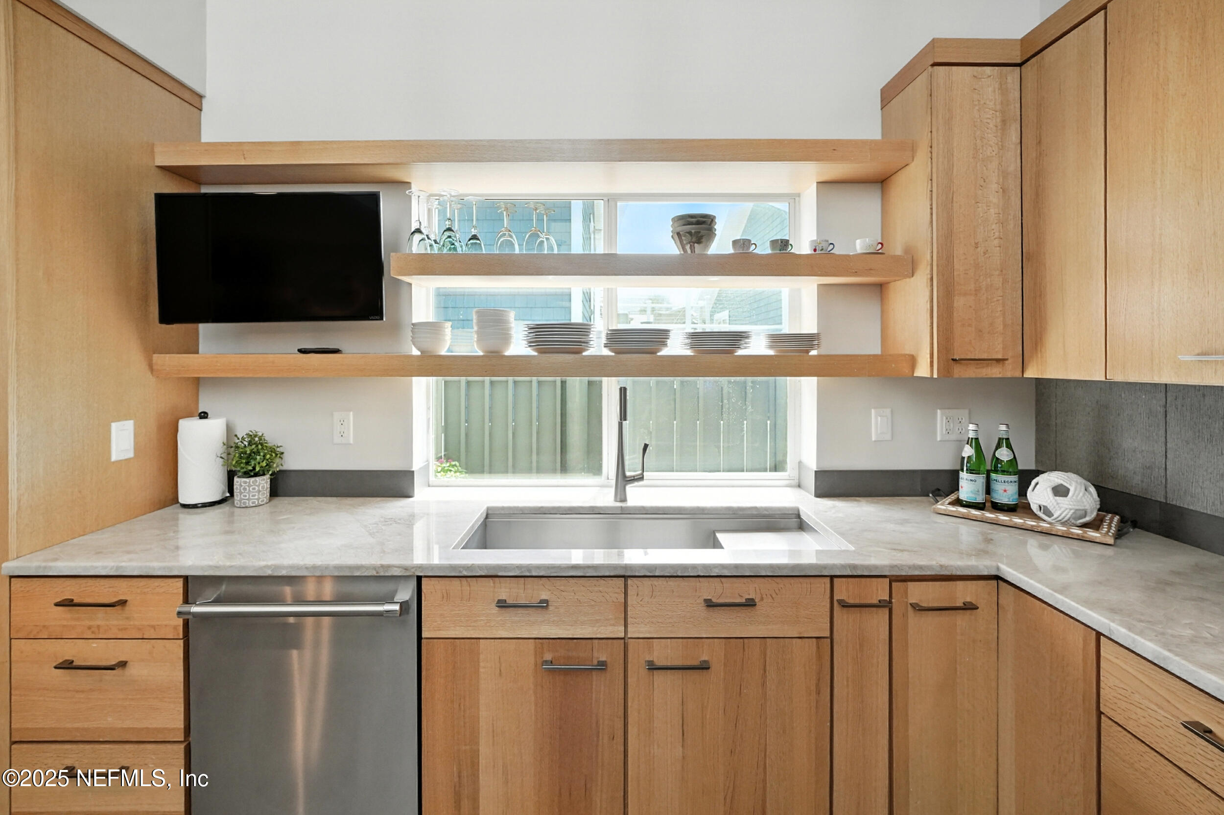 1789 Beach Avenue Atlantic Beach, FL 32233 - Photo 10 of 55 a kitchen with granite countertop a sink stainless steel appliances and cabinets