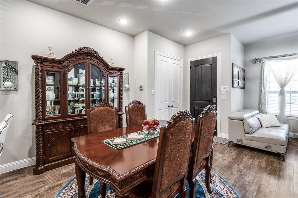 1560 Windermere Way Dallas, TX 75234 - Photo 4 of 25 Dining space featuring baseboards and dark wood-style floors