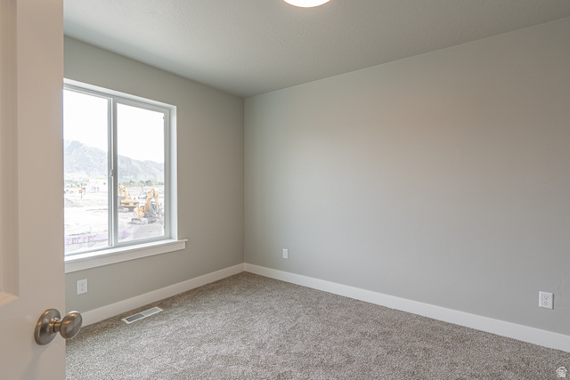 2257 South 1090 West, Unit 74 Nibley, UT 84321 - Photo 9 of 40 Neutral tone wall finishes, gray carpeting, and white trim