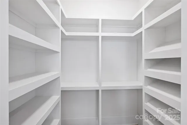 a view of an empty walk in closet