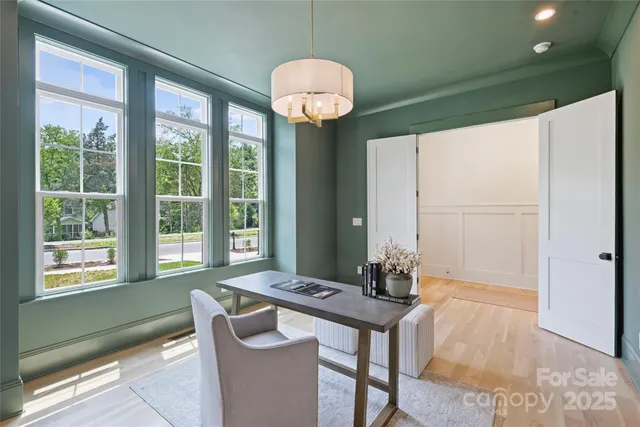 a dining room with furniture and window