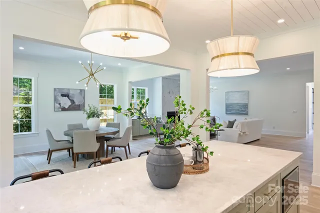 a dining room with furniture and a chandelier
