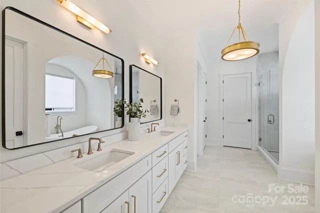 a bathroom with a double vanity sink and a mirror