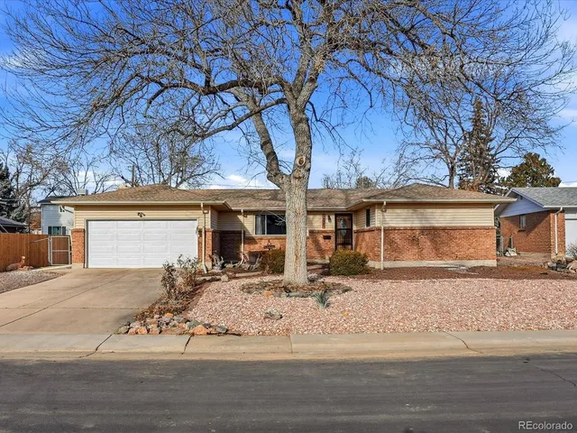 front view of a house with a tree
