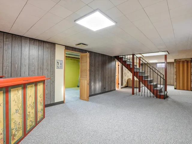 a view of an empty room with stairs