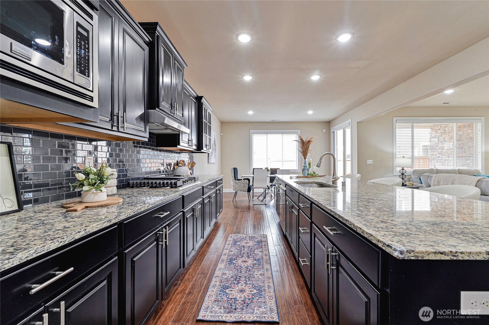 17312 40th Avenue Southeast Bothell, WA 98012 - Photo 10 of 34 a large kitchen with granite countertop lots of counter space and stainless steel appliances
