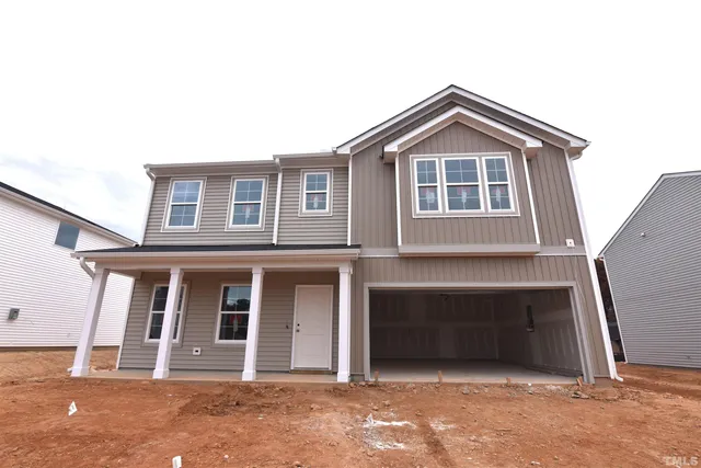 a front view of a house with a garage