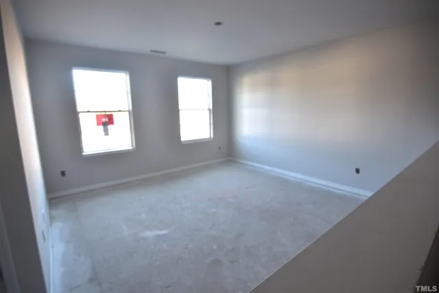 a kitchen with granite countertop a sink a counter top space and living room view