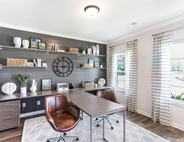 a spacious bedroom with a bed and a window