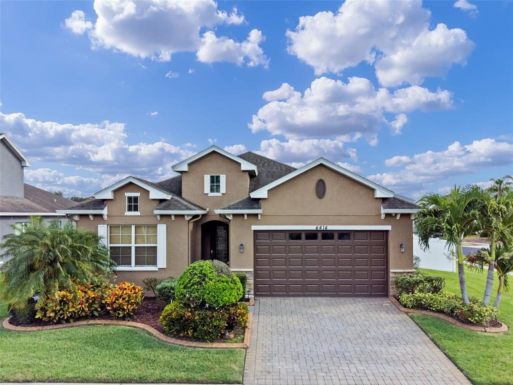 4414 Azure Isle Way Kissimmee, FL 34744 - Photo 1 of 1 front view of a house with a yard