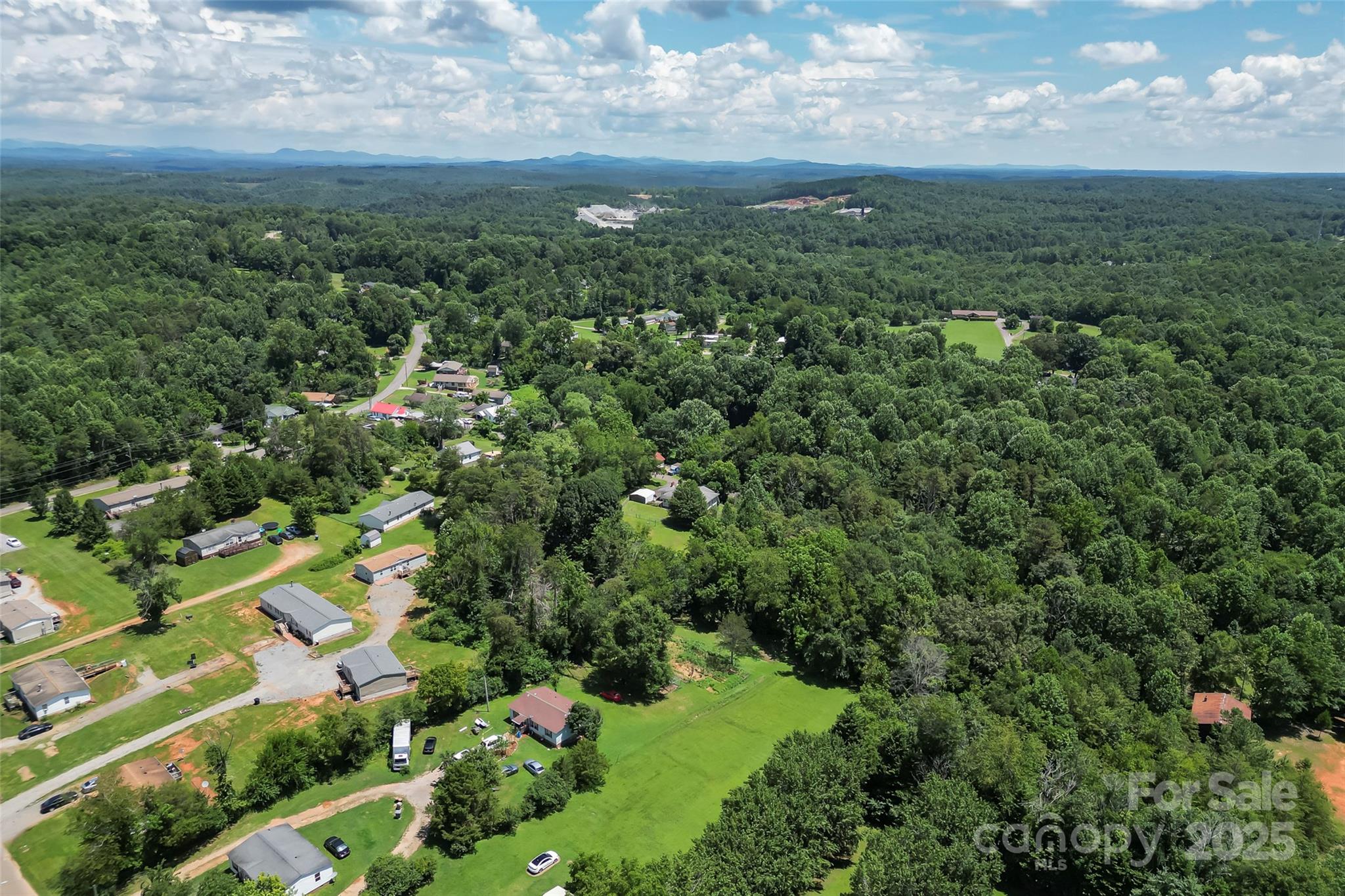 0 Setzer Drive Morganton, NC 28655 - Photo 5 of 9 an aerial view of residential houses with outdoor space and trees
