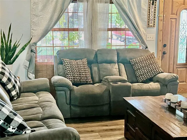 a living room with furniture and a window