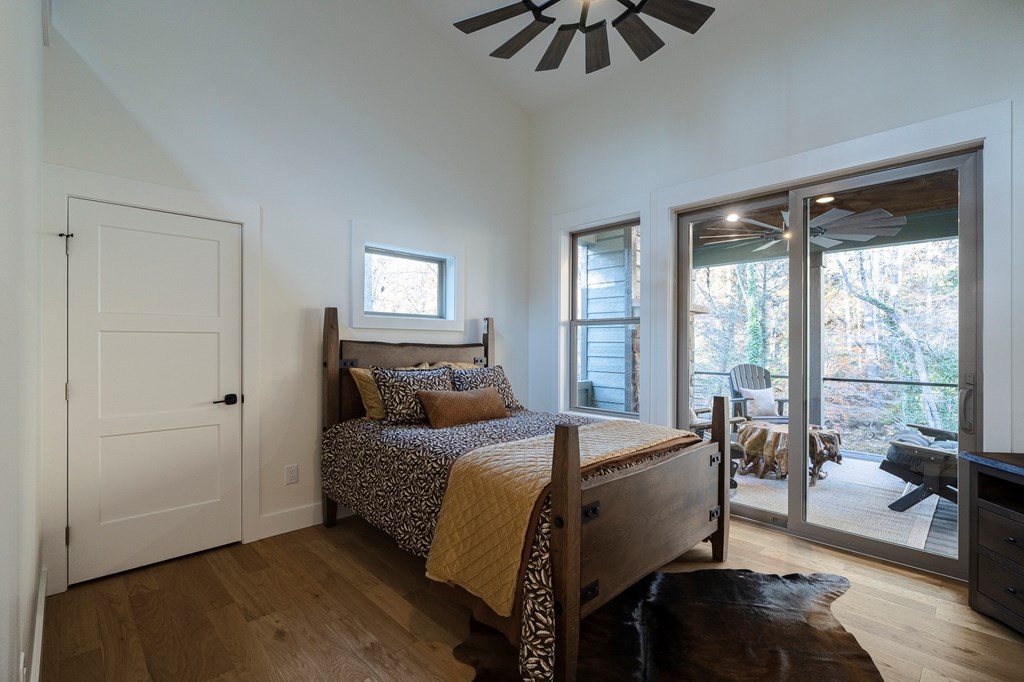 1214 John Abernathy Road Blairsville, GA 30512 - Photo 22 of 53 a bed room with a bed and a chair