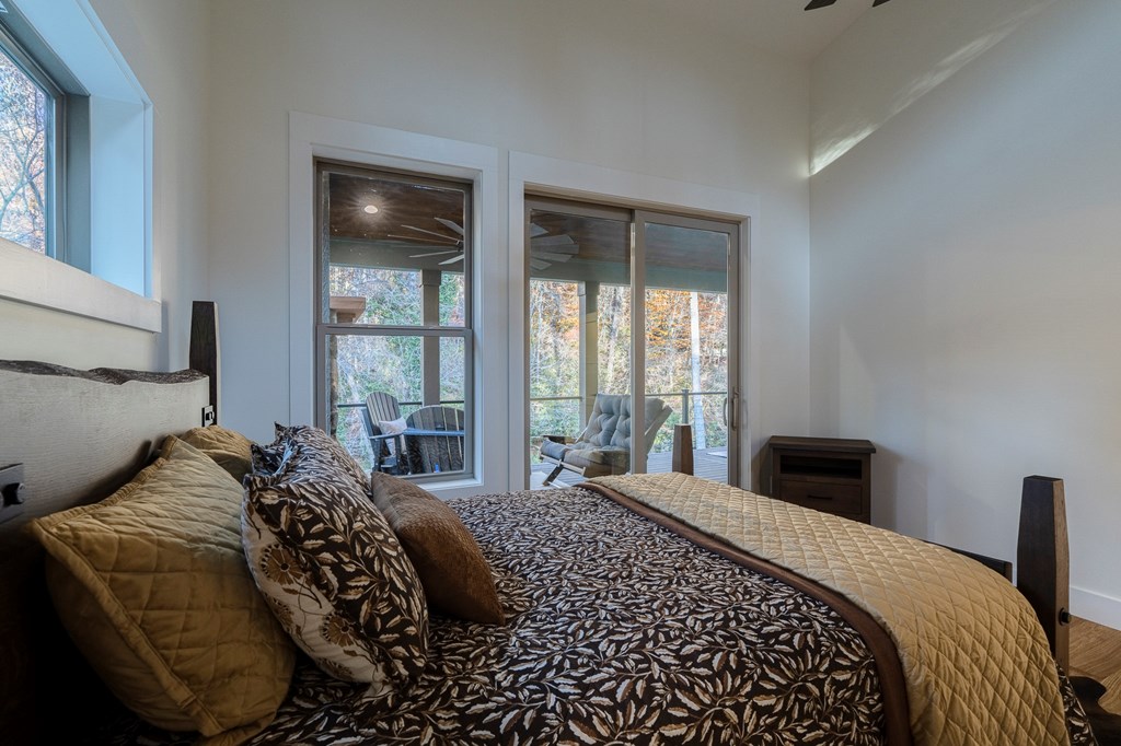 1214 John Abernathy Road Blairsville, GA 30512 - Photo 23 of 53 a bedroom with a large bed and a window