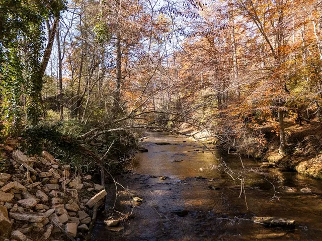 a large kitchen with stainless steel appliances lots of counter top space