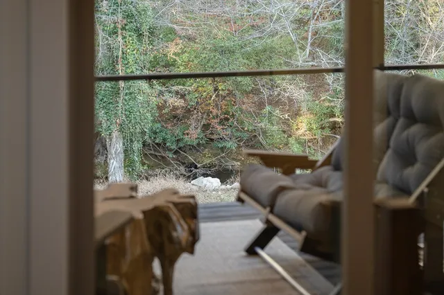 a view of a living room with furniture and a window