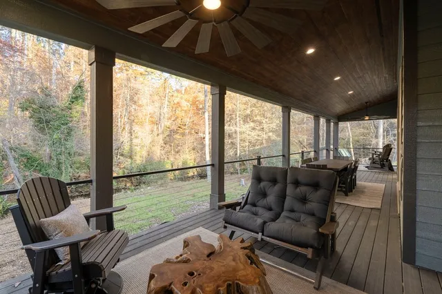 a balcony with furniture and a gate