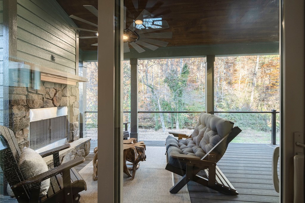 1214 John Abernathy Road Blairsville, GA 30512 - Photo 43 of 53 a balcony with furniture and a gate